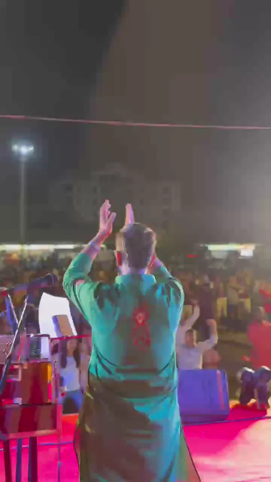 A crowd gathered in front of the stage during a live performance